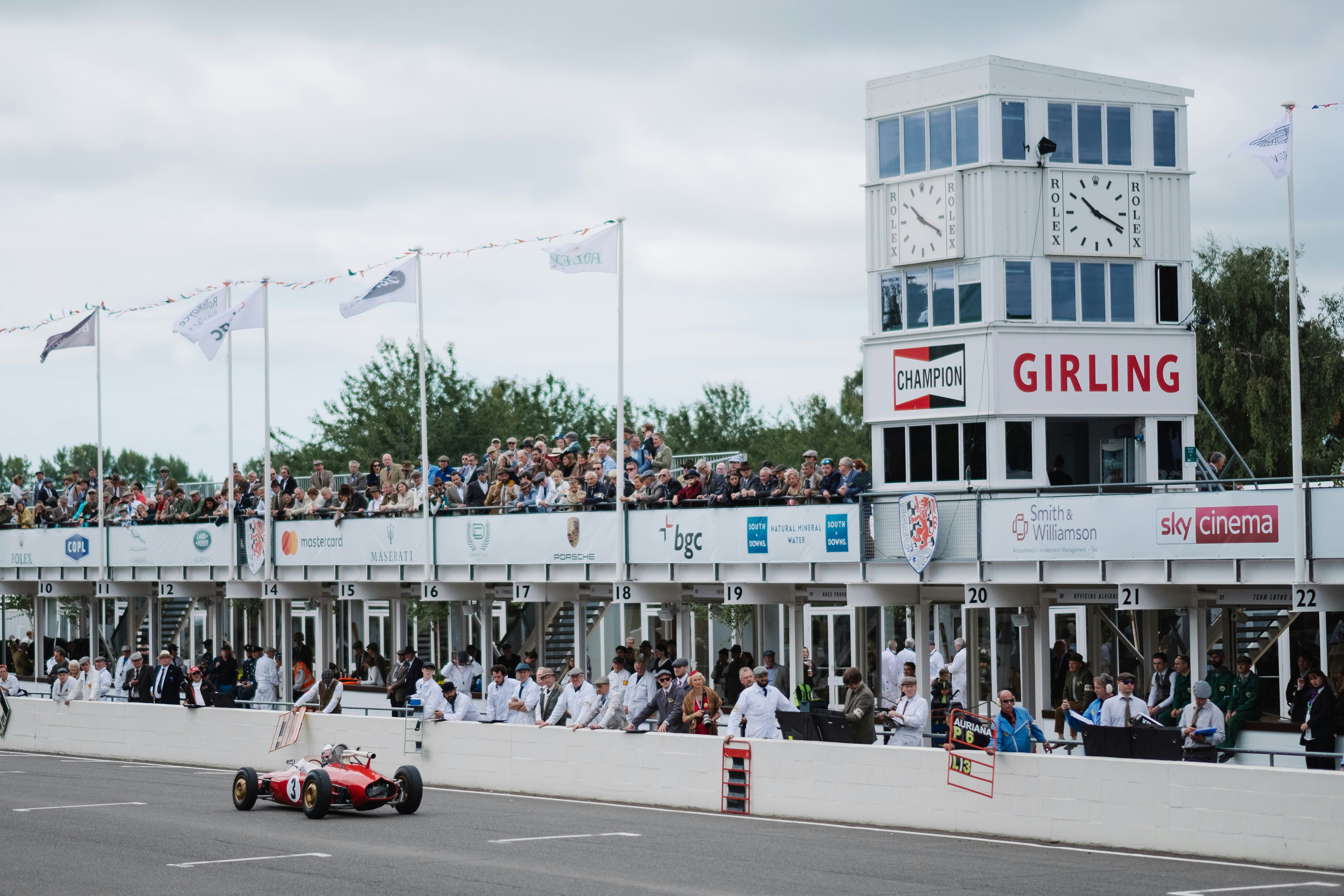 red racing car on asphalt road